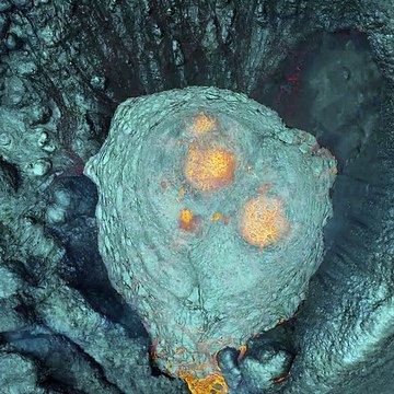 Check out this amazing drone footage capturing a volcanic eruption from above. It's truly fascinating!
