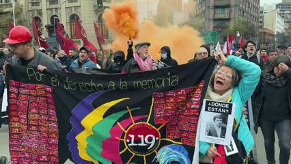 Protesters clash with police during march on eve of Pinochet coup anniversary