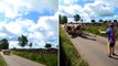 Moment quick-thinking cyclist stops herd of cows escaping as helpless farmer chases them