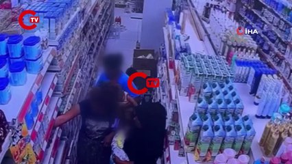 Marketten bebek maması çalan kadının mamayı eteğinin içine sakladığı anlar