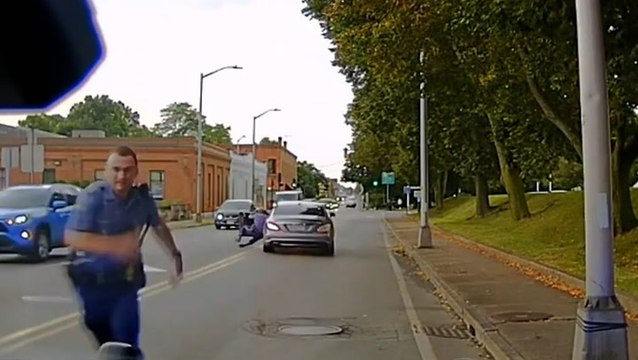 Police officer dragged along road by fleeing driver during routine traffic stop