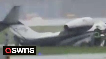 Terrifying moment private plane carrying eight people skids off runway amid bad weather