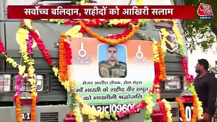 Martyr wrapped in tricolor, salute by son in uniform