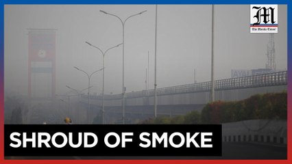 Firefighters battle peatland blazes as haze shrouds Indonesian city