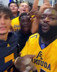 Rick Ross gets his son's football team hyped before the game