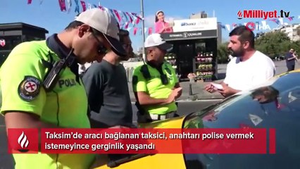 Taksim'de taksici, polisle tartıştı: Arabamı bağlatamam