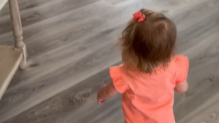 Precious toddler beaming with excitement while meeting newborn sister for the 1st time!