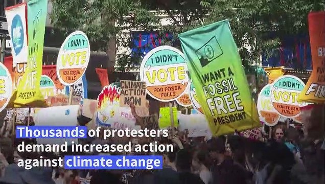 Climate protesters throng New York, demand end to fossil fuels