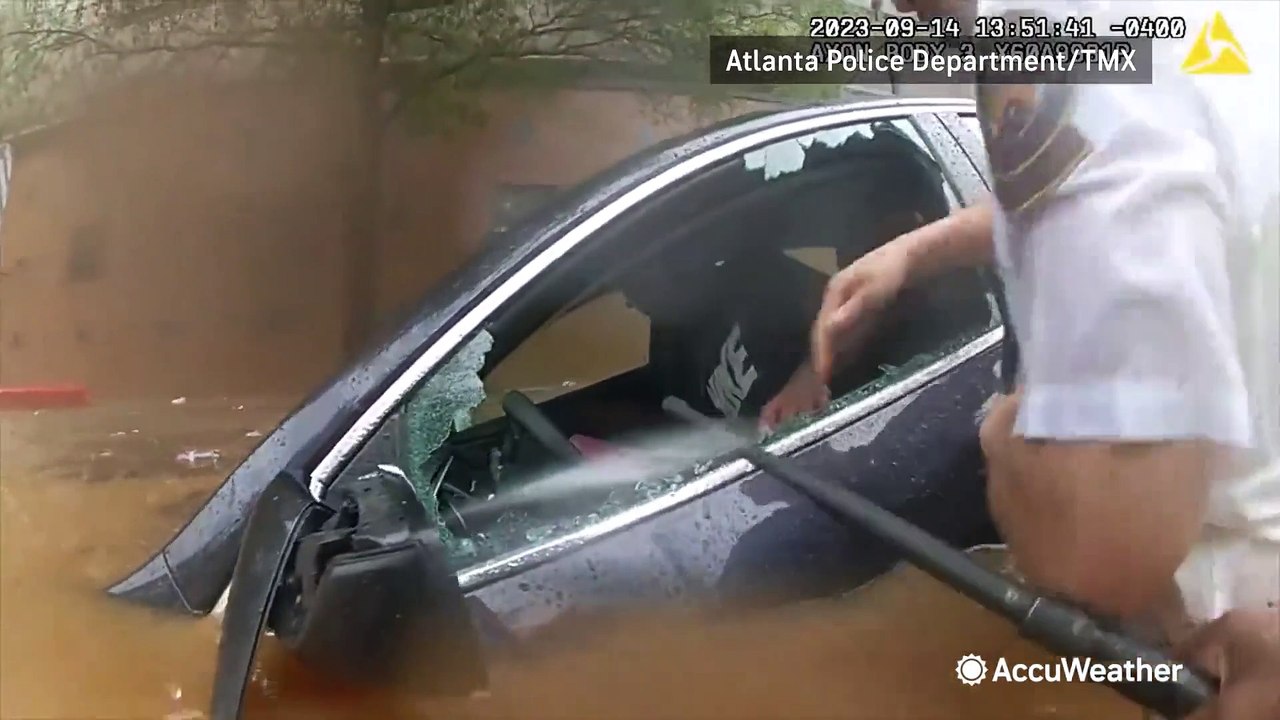Driver rescued from flood water