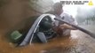 Trapped driver in flooded car rescued in dramatic police bodycam footage