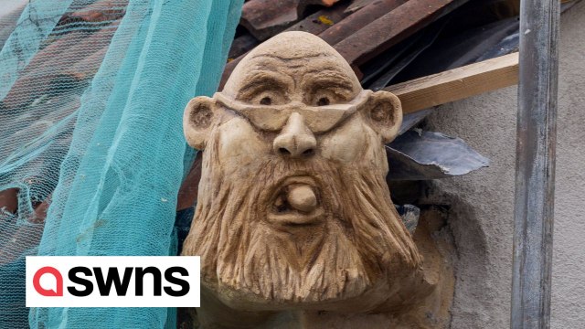 Fuming builder erects stone gargoyle of local official on his roof as planning row turns ugly