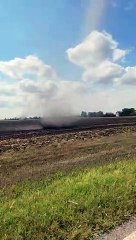 Dust Devil Moves Through Harvested Corn Field