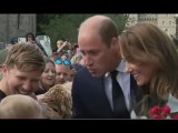 Prince William adorably pulls faces at baby in crowds watched by Kate