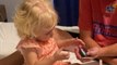 Cute toddler tries her hand at reading the cards in her dad's wallet *Cute Video*