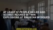 At least 57 people killed and scores injured in twin explosions at Pakistan mosques