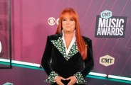 Wynonna Judd has recalled holding her mother Naomi in her arms shortly after her death