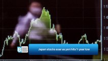 Japan stocks soar as yen hits 1-year low
