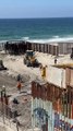 Migrants and Stray Dog Run Across Open US-Mexico Border Fence in Tijuana