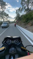 Motorcycle Follows Wheelchair Down Hill
