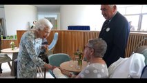 Royal Oops! See the Moment a Man's Phone Rings Just as He's Shaking Hands with Queen Elizabeth