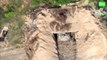 Ukrainian forces target a Russian line of trenches and camouflaged dugouts