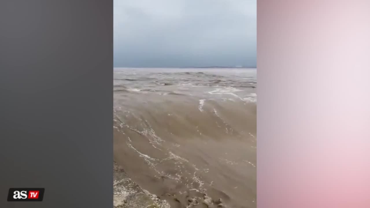 Watch: Hundreds gather to watch giant waves on Qiantang River in China