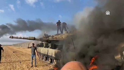 Silahlı grubun ele geçirdiği yanan tanktan görüntüler