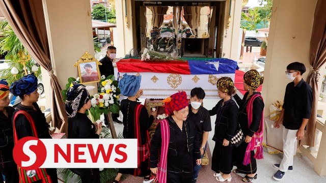 Thai mall shooting victim's mother bids emotional farewell at cremation