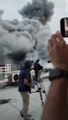Shocking moment BBC reporting team duck for cover as Israeli missile strike destroys building near broadcaster's rooftop base in Gaza - before second explosion halts another live report