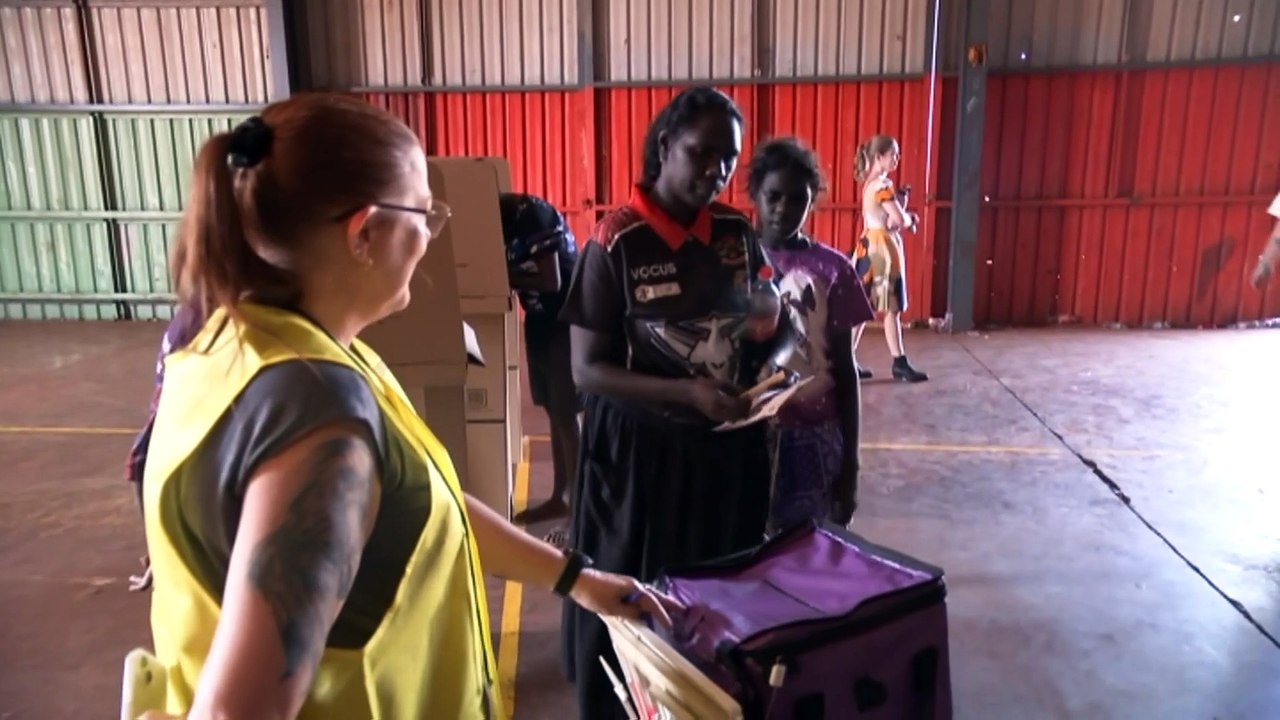 Community worker travels to remote communities encouraging people to enrol to vote