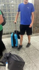 Baby Rides Through Airport Strapped To Carry-On Suitcase