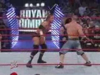 John Cena and Triple H are kicking at each other      