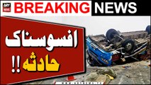 Speeding passenger bus overturns in Karachi