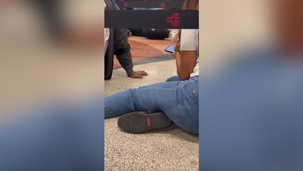 Passengers lay on ground after Atlanta airport stabbing