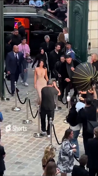 Kylie Jenner looked nothing short of sensational in a figure-hugging sparkly gold gown.