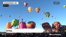 Hot air balloons soar through the sky at annual International Balloon Fiesta in Albuquerque