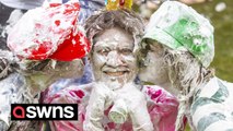 Students cover each other with foam and give mentors a pound of raisins - in bizarre tradition