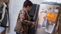 Mom chooses laughter over panic after son plays EVIL fridge prank on her