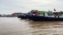 Tugboats Pulling a long Barge at Koh Kret Island in Thailand