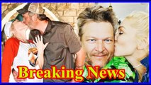 Gwen Stefani and Blake Shelton share a kiss as they pick out pumpkins