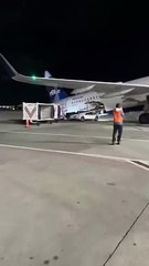 JetBlue plane tips upward as passengers disembark at JFK Airport in New York