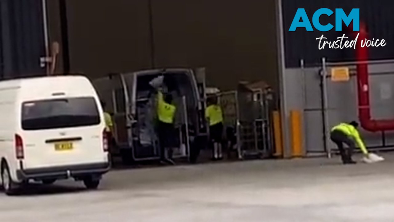 Australia Post apologises after workers filmed throwing packages