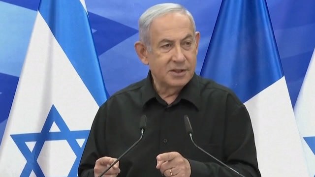 Benjamin Netanyahu claims Hamas are putting people at check points with guns to prevent Palestinians from leaving.