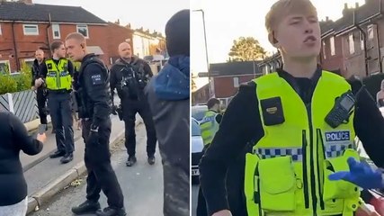 Moment man pulls ‘gun’ on police officers as he wanders along busy M1