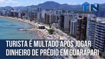 Turista é multado após jogar dinheiro de prédio em Guarapari