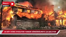 Onlarca köy evini etkileyen yangın söndürülmeye çalışılıyor