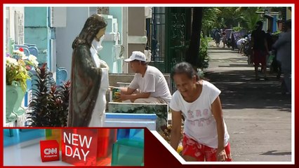 Families clean tombs ahead of All Saints' Day