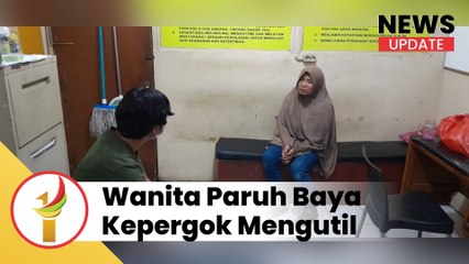 wanita paruh baya kepergok mengutil