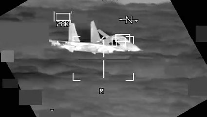 Moment Chinese fighter jet flies within 10 feet of American B-52 bomber