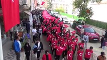 Mereto Dağı eteklerinde dev Türk bayrağı eşliğinde 100. yıl yürüyüşü